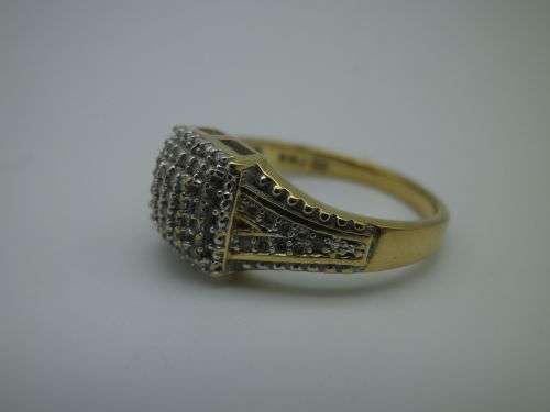 9ct yellow gold and diamond cluster NMJ DESIGNER ring. Diamond: 0.22ct Size: J-K SI Certificate