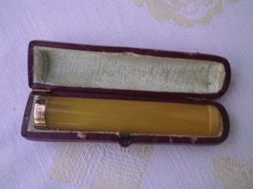 Vintage Cheroot Holder. Bakelite or Celluloid  with gold tone tip in Original leather case
