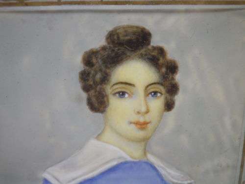 Antique hand-painted miniature portrait behind glass in ornate metal frame. 15cm