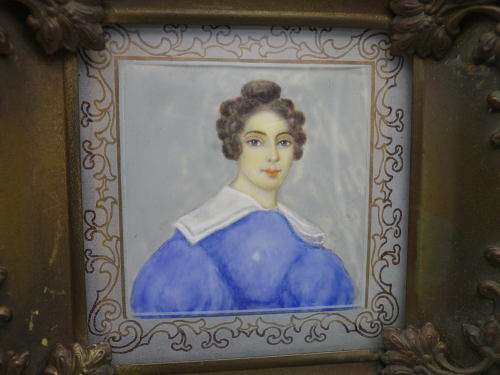 Antique hand-painted miniature portrait behind glass in ornate metal frame. 15cm