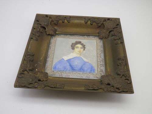 Antique hand-painted miniature portrait behind glass in ornate metal frame. 15cm