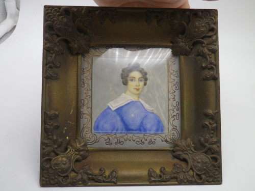 Antique hand-painted miniature portrait behind glass in ornate metal frame. 15cm
