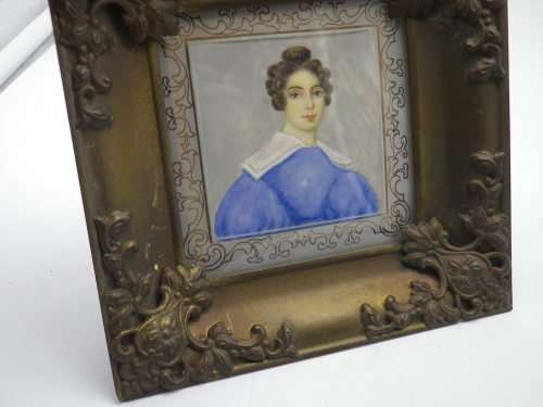 Antique hand-painted miniature portrait behind glass in ornate metal frame. 15cm