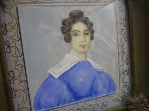 Antique hand-painted miniature portrait behind glass in ornate metal frame. 15cm