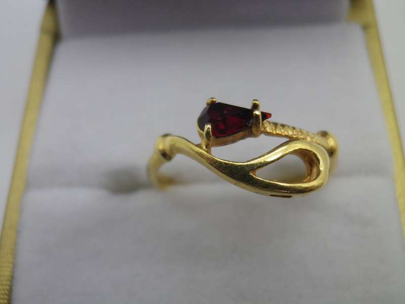 18ct Gold ring with red pear shaped stone- possibly Ruby. Size N. Approx 2grms