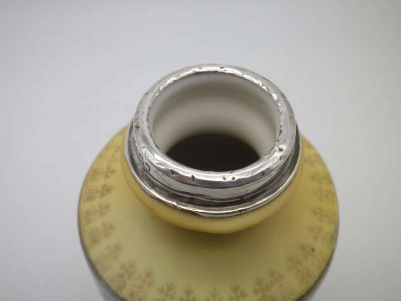 Antique Victorian porcelain vase with Hallmarked Silver rim. London 1910
