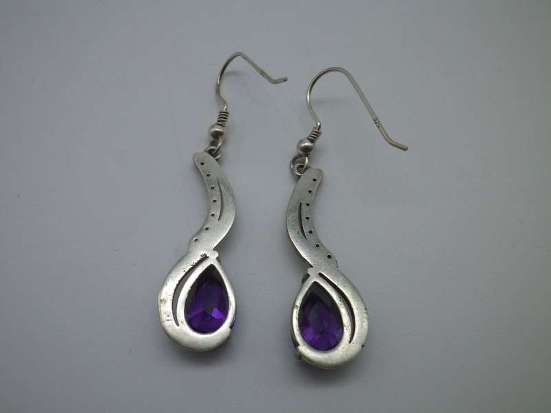 925 Sterling silver drop earrings with pearcut purple stones & 7 cubic zirconias. 3.5cm 6.6g