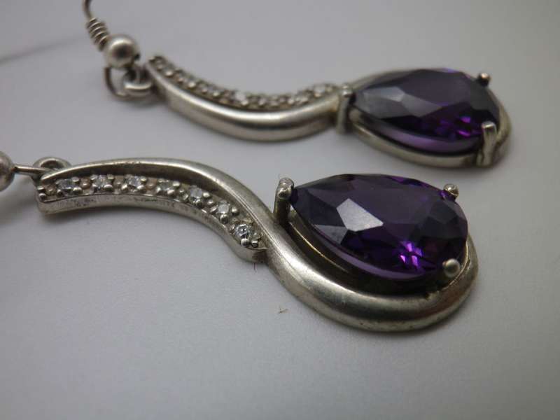 925 Sterling silver drop earrings with pearcut purple stones & 7 cubic zirconias. 3.5cm 6.6g
