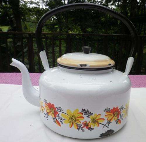 Nice large vintage enamel kettle. Pretty flowers on white.