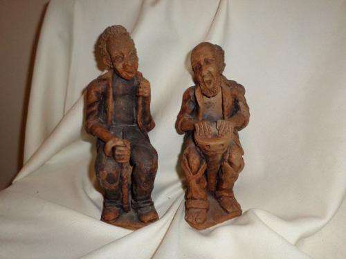 2 OLD MAN SITTING IN FRONT OF THE RONDAWEL TALKING ABOUT THE GOOD OLD  DAYS (MADE OF CLAY)