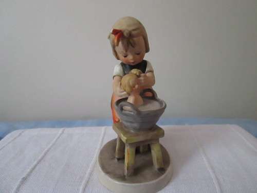 GOEBEL FIGURINE  MADE IN W GERMANY-  GIRL WASHING THE BABY IN A BUCKET