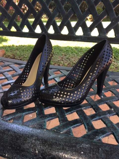 High black heels featuring small square cut outs
