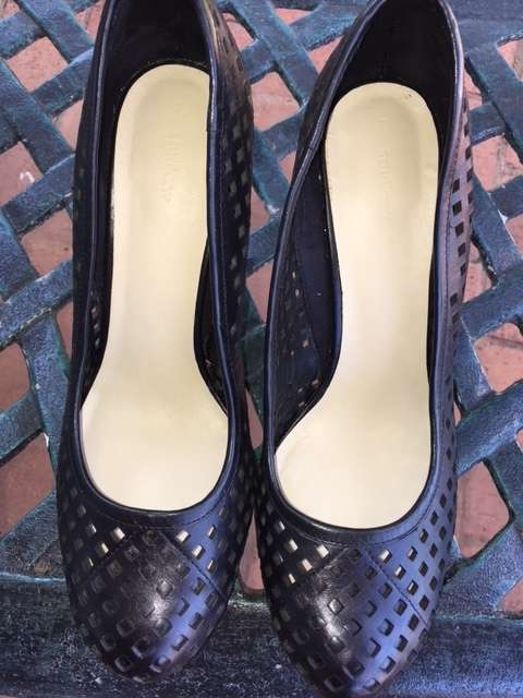 High black heels featuring small square cut outs