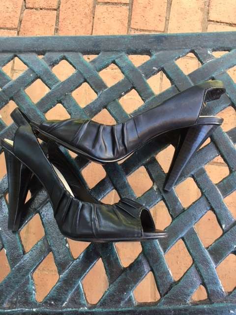 Black peep-toe sling back heels