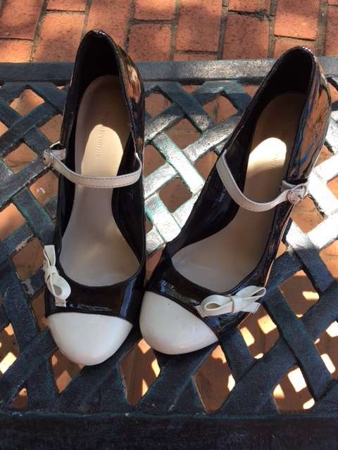 Black Mary-Jane Heels with White Cap Toe and Bow Detail