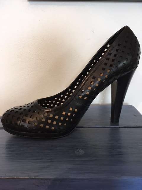 High black heels featuring small square cut outs