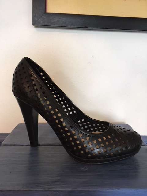 High black heels featuring small square cut outs