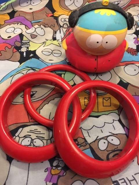Three bright red bangles