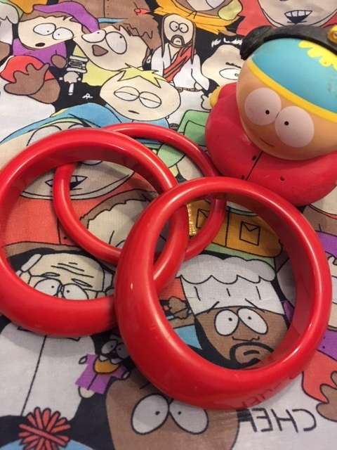 Three bright red bangles