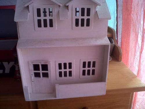 4 Room wooden doll house with miniature brass and copper furniture and home ware