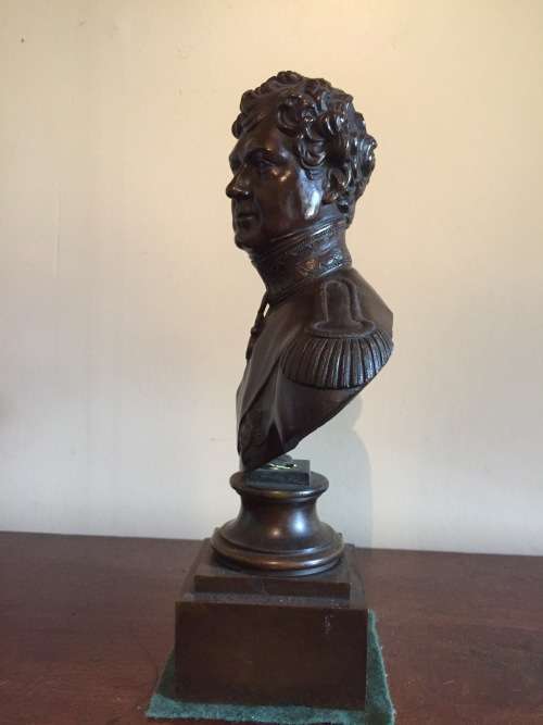 A BRONZE BUST OF GEORGE IV