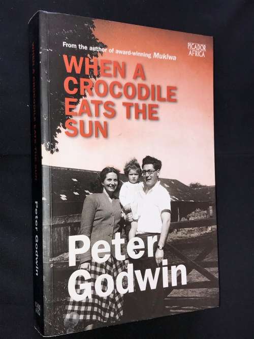 WHEN A CROCODILE EATS THE SUN BY PETER GODWIN