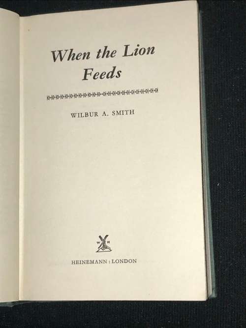 WHEN THE LION FEEDS BY WILBUR SMITH