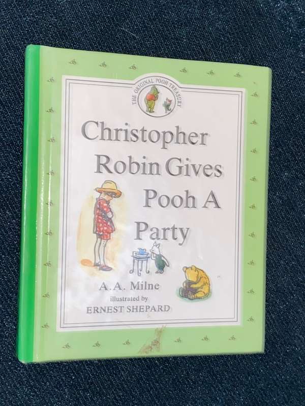 CHRISTOPHER ROBIN GIVES POOH A PARTY BY A.A. MILNE