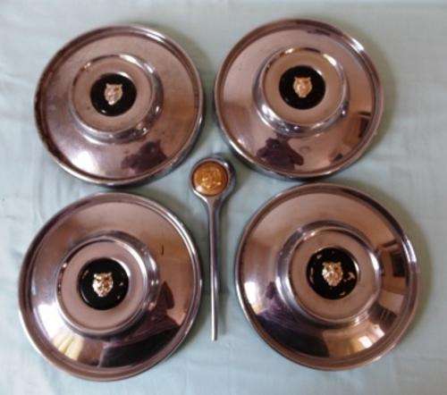 4 Jaguar hub caps and grill badge