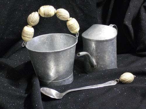 Tin sugar bucket and milk dispenser decorated with beads
