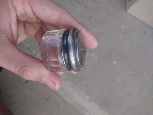 Klein antieke glas hourtjie met sterling silver prop