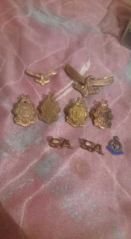 small collection of 9 Badges