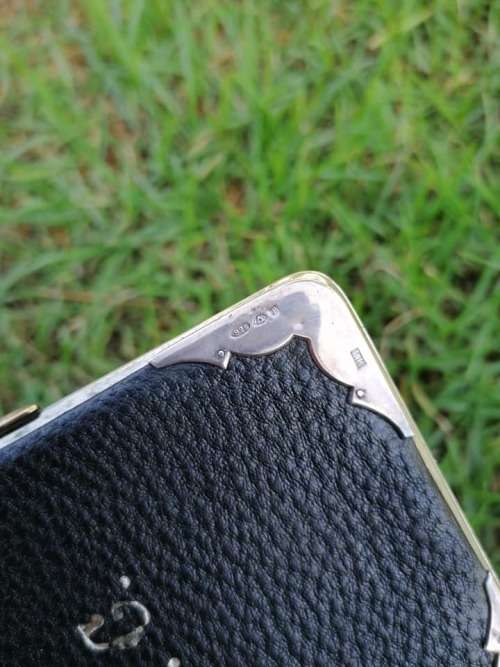 Silver and genuine Leather holder