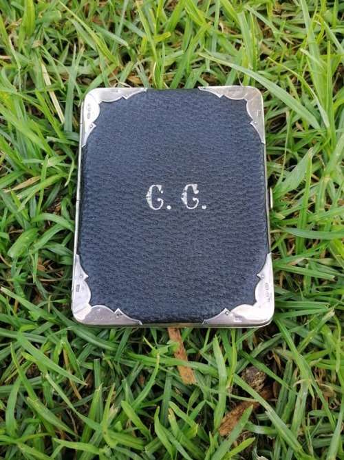 Silver and genuine Leather holder