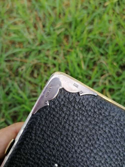 Silver and genuine Leather holder