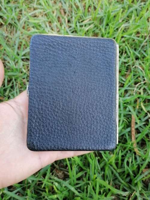 Silver and genuine Leather holder