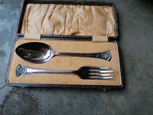 set of Hallmark E.P. N.S fork and spoon, in a snake looking box dated 1931