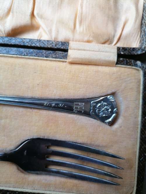 set of Hallmark E.P. N.S fork and spoon, in a snake looking box dated 1931