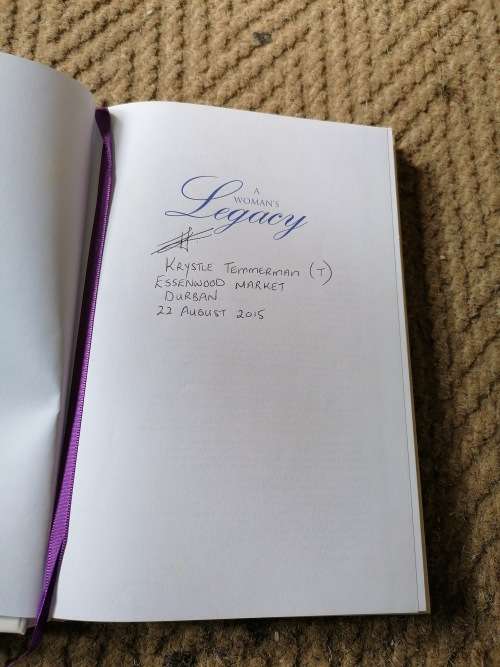 A WOMEN`S LEGACY SIGNED BY AUTHOR