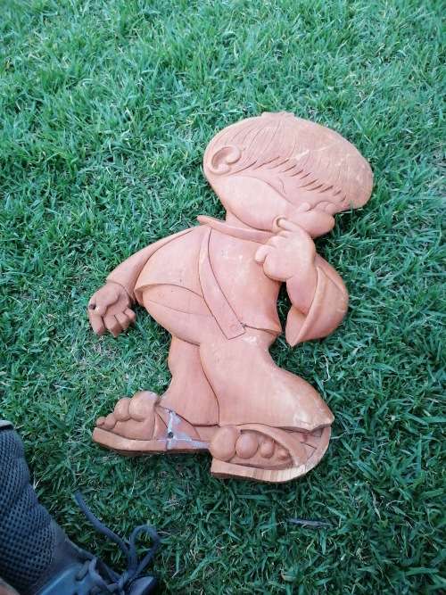 Vintage wooden carving of a boy. Condition as per picture