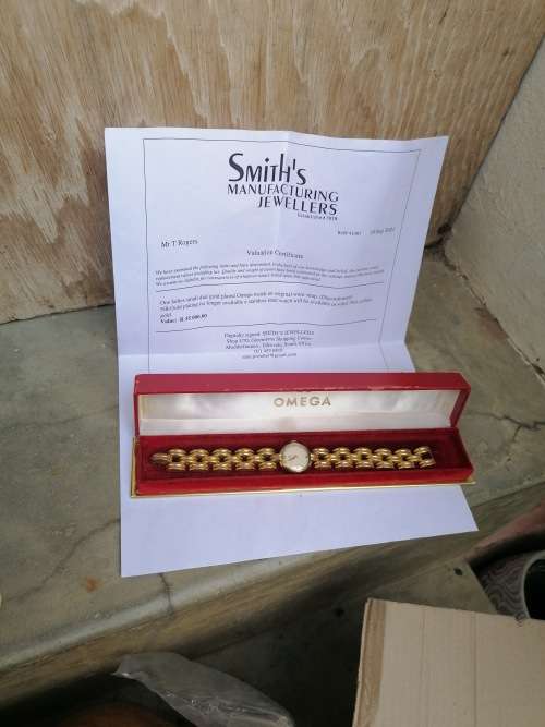 Working omega watch with original box. Valued at R35 000