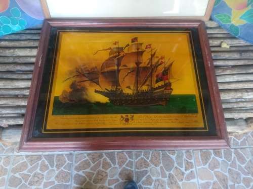 Framed gold color print on glass