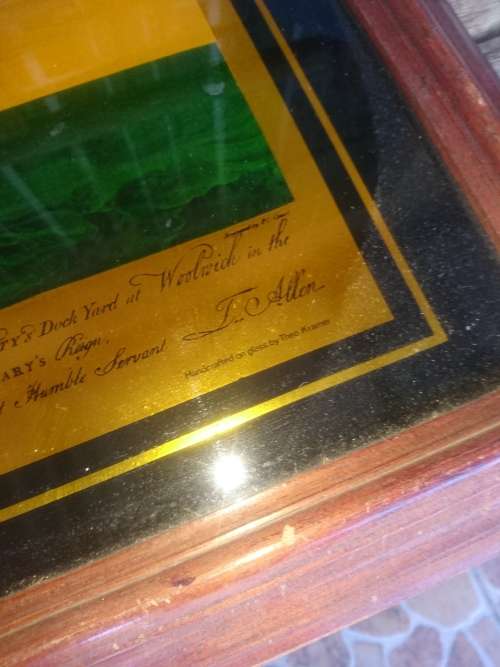 Framed gold color print on glass