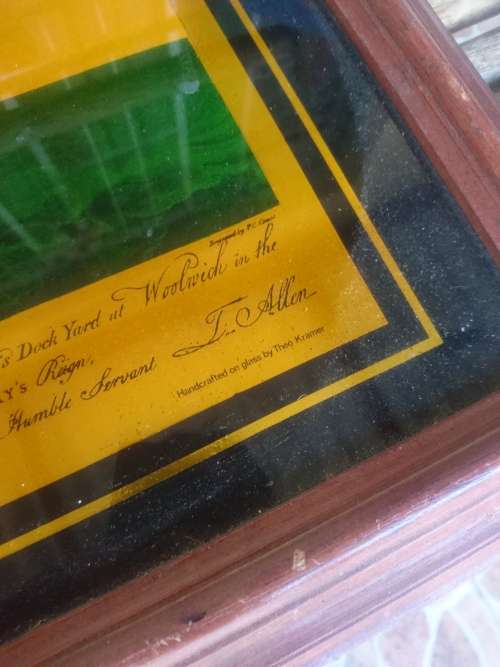 Framed gold color print on glass