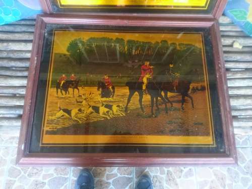 Framed gold color print on glass