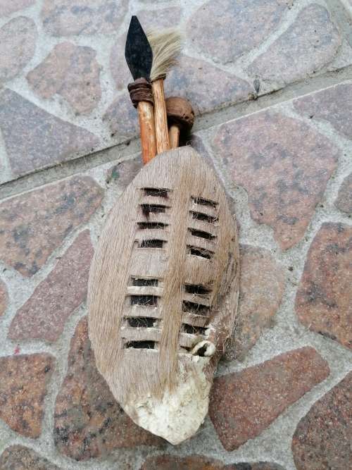 Minature shield ornament. Real animal hide