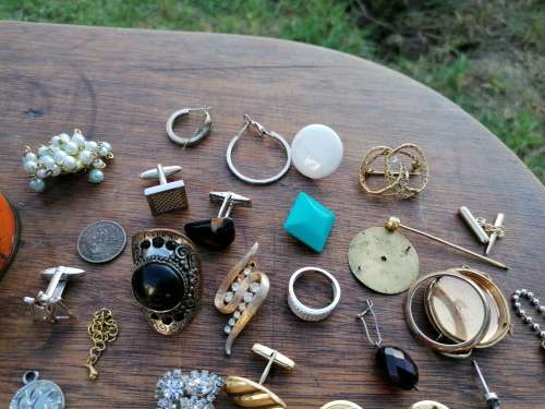 AN OLD TIN WITH BITS AND BOBS