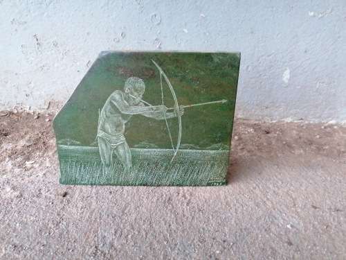 Stunning art piece on stone of a bushman
