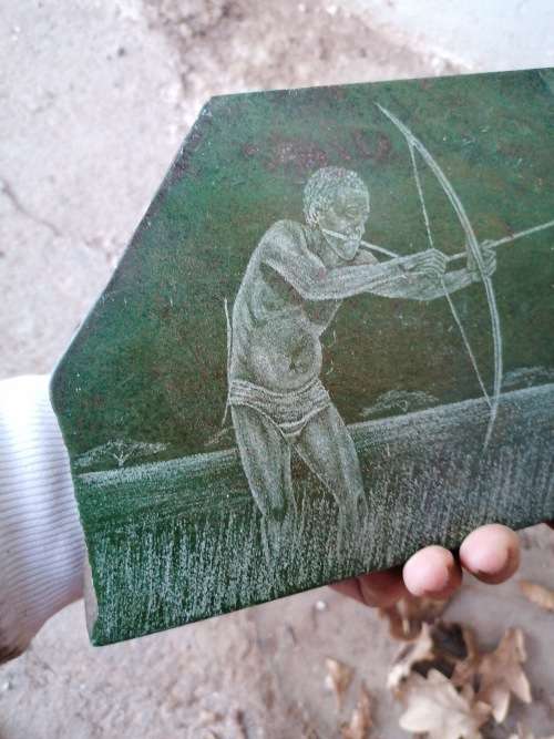 Stunning art piece on stone of a bushman