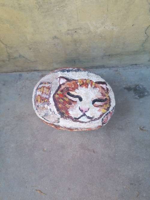 Cat painting on rock